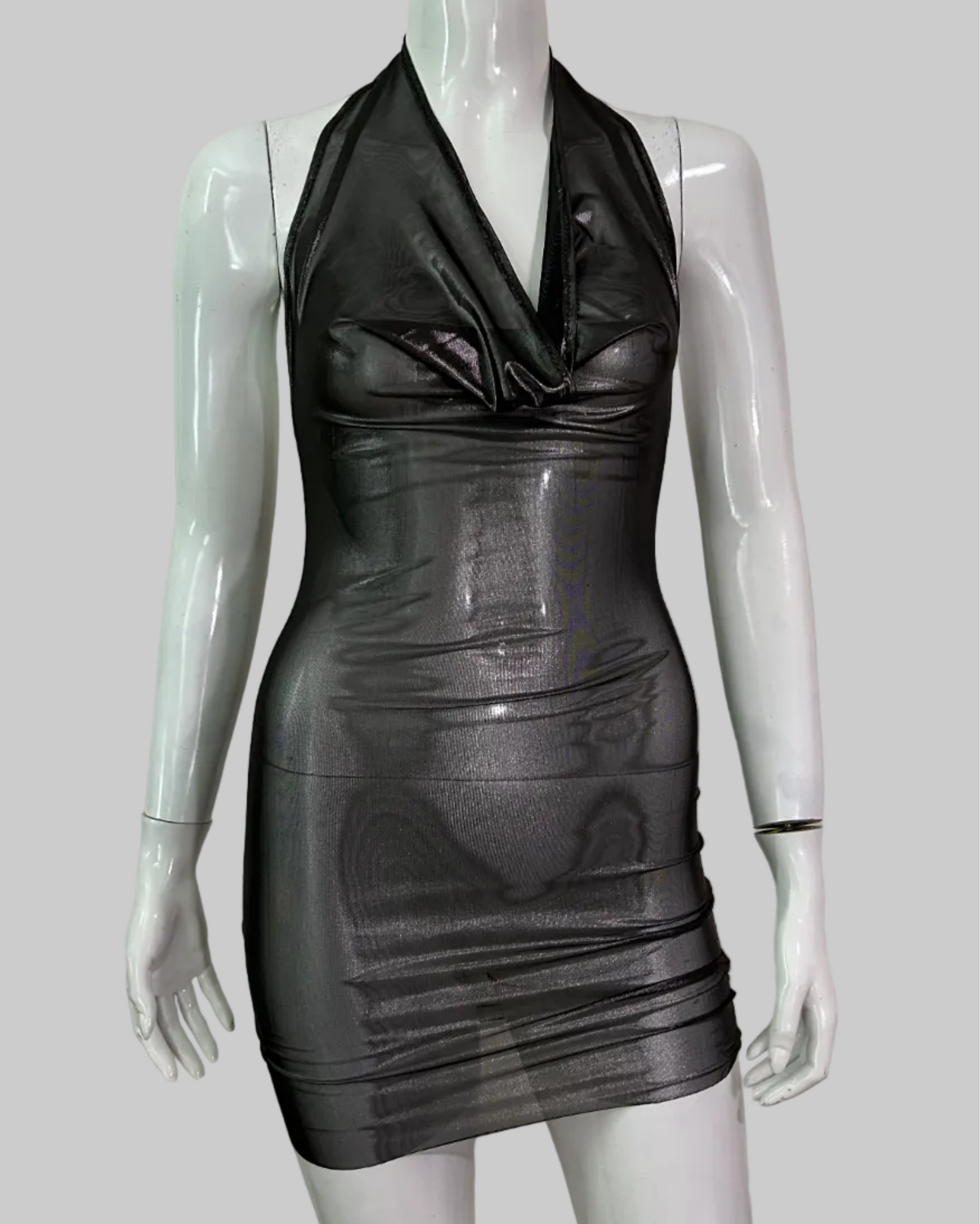 A sleeveless, bodycon mini dress in a shiny black silver metallic mesh material handmade in nyc