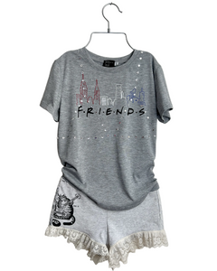 Gray upcycled  'Friends' themed t-shirt and shorts set on a hanger against a light background